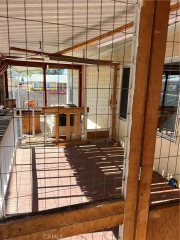 a living room with furniture next to a large window