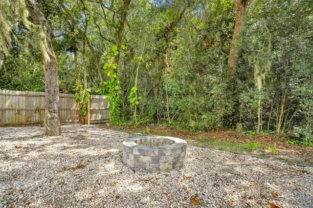 a view of a yard with trees