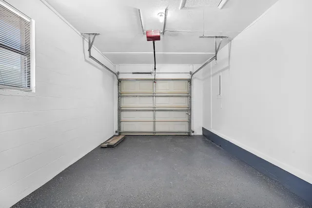 a view of room that has a white walls