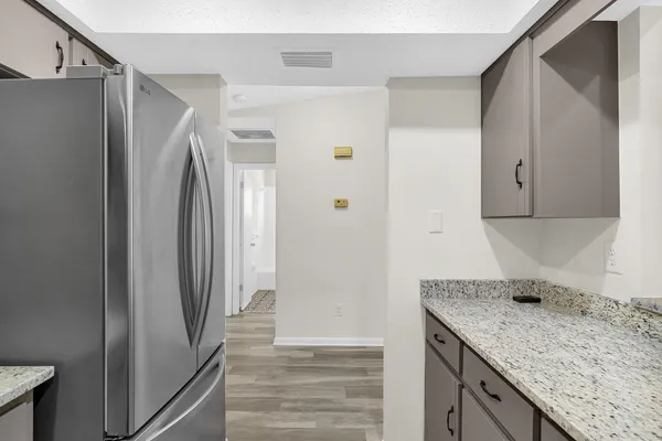 a kitchen with a refrigerator and countertop