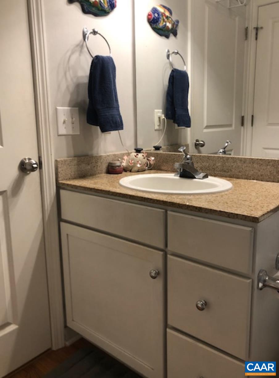 735 Walker Square Charlottesville, VA 22903 - Photo 8 of 9 a bathroom with a sink and a mirror