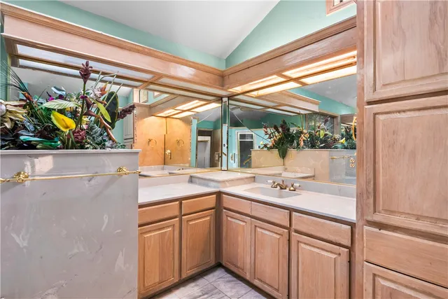 a bathroom with a tub and a chandelier