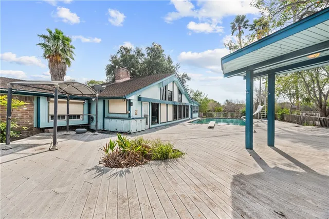 a couple of potted plants in front of house