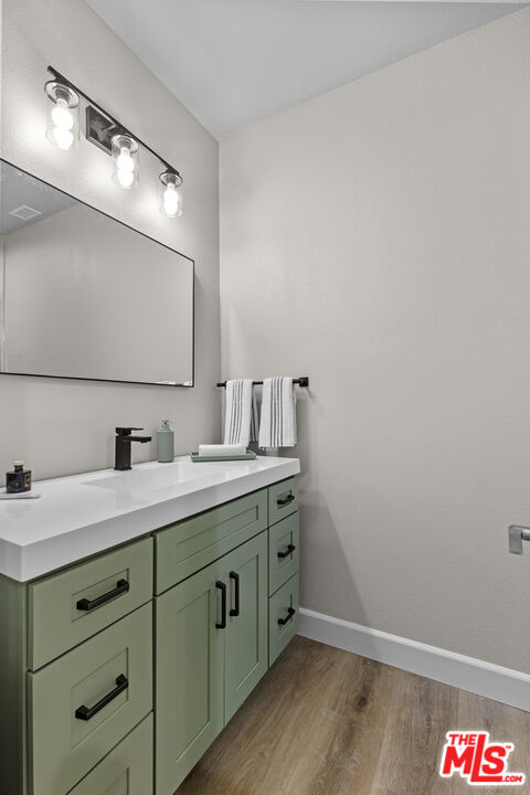 28701 Delaware Drive Tehachapi, CA 93561 - Photo 13 of 15 a bathroom with a sink and a mirror