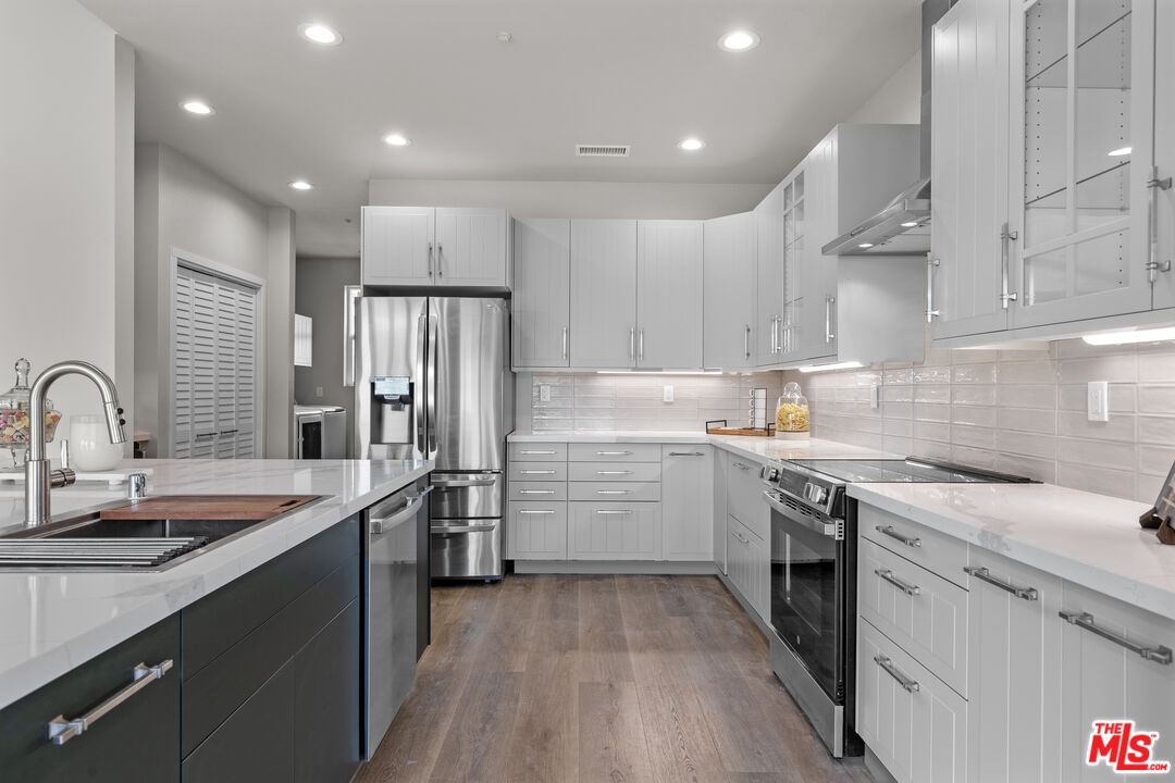 28701 Delaware Drive Tehachapi, CA 93561 - Photo 6 of 15 a kitchen with a sink stainless steel appliances and cabinets
