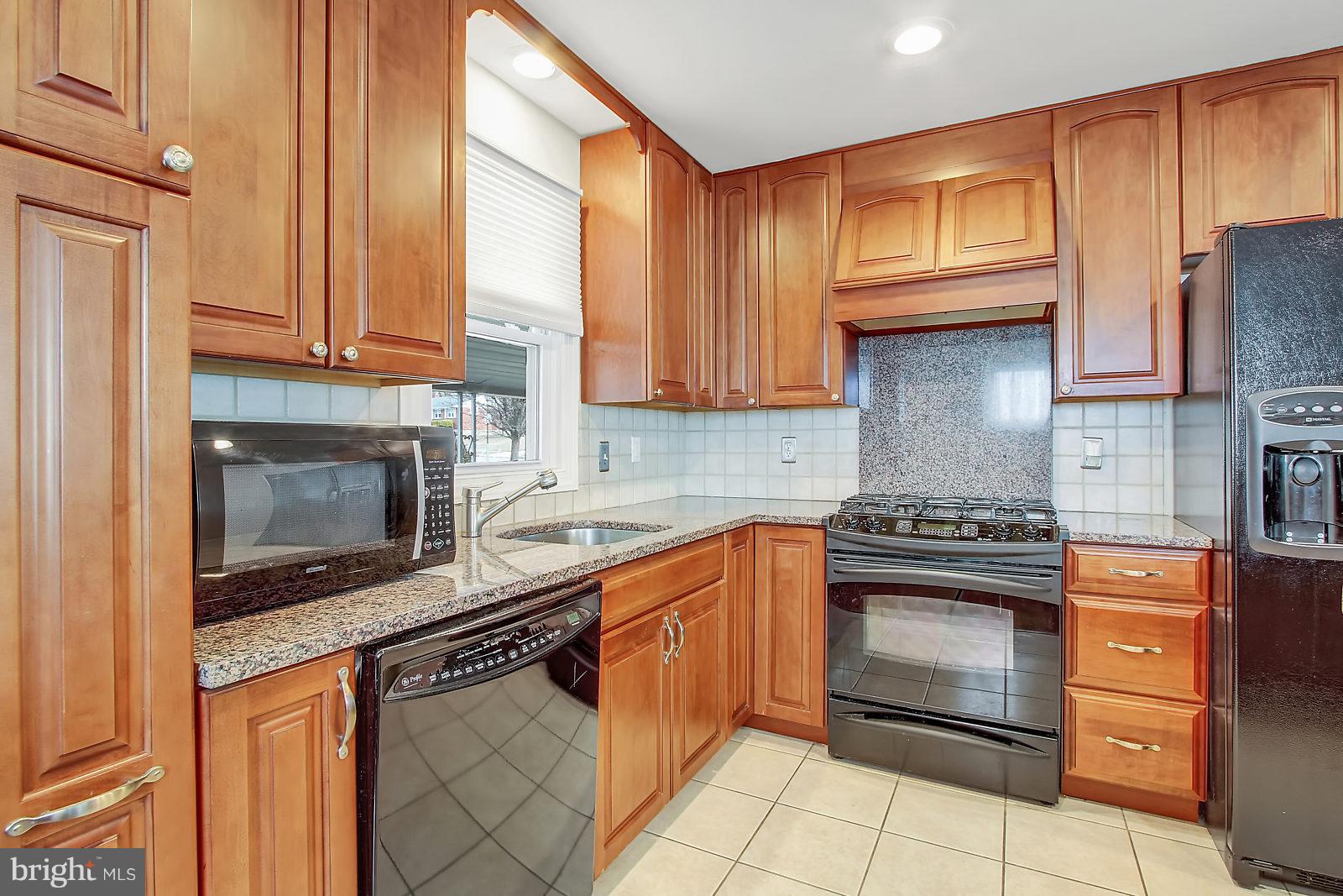 2436 Lakewood Road Baltimore, MD 21234 - Photo 12 of 31 Granite counter tops and back splash above stove!