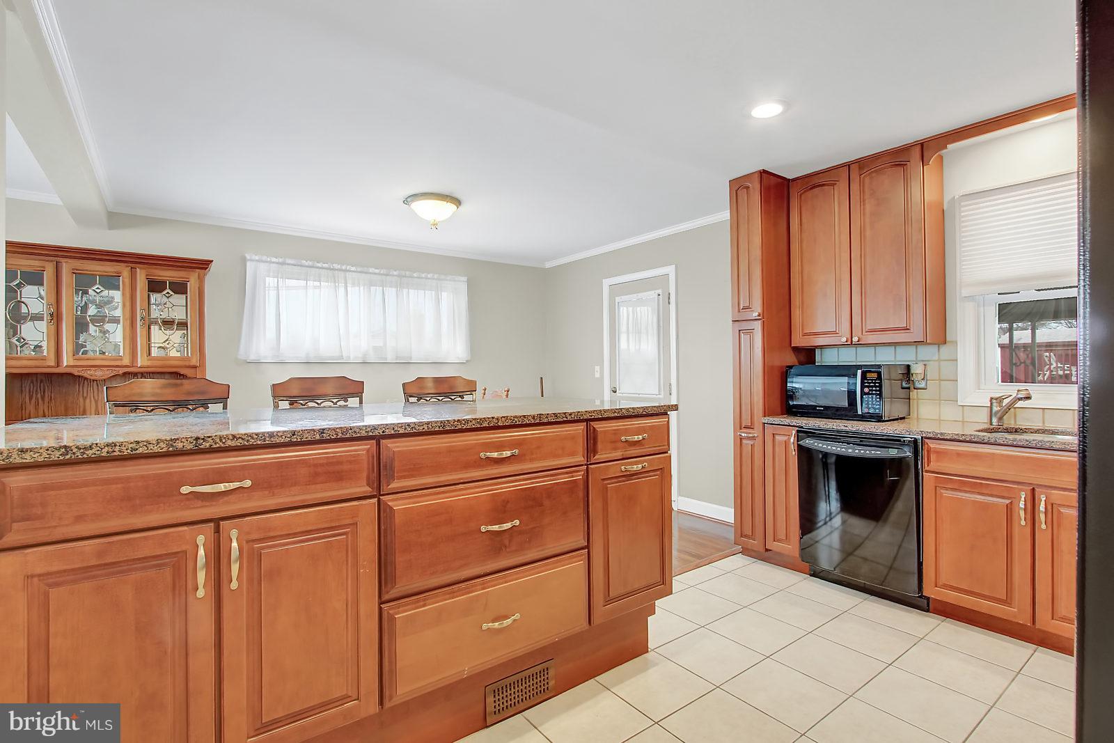 2436 Lakewood Road Baltimore, MD 21234 - Photo 13 of 31 Gleaming maple cabinets and tons of cooking space!