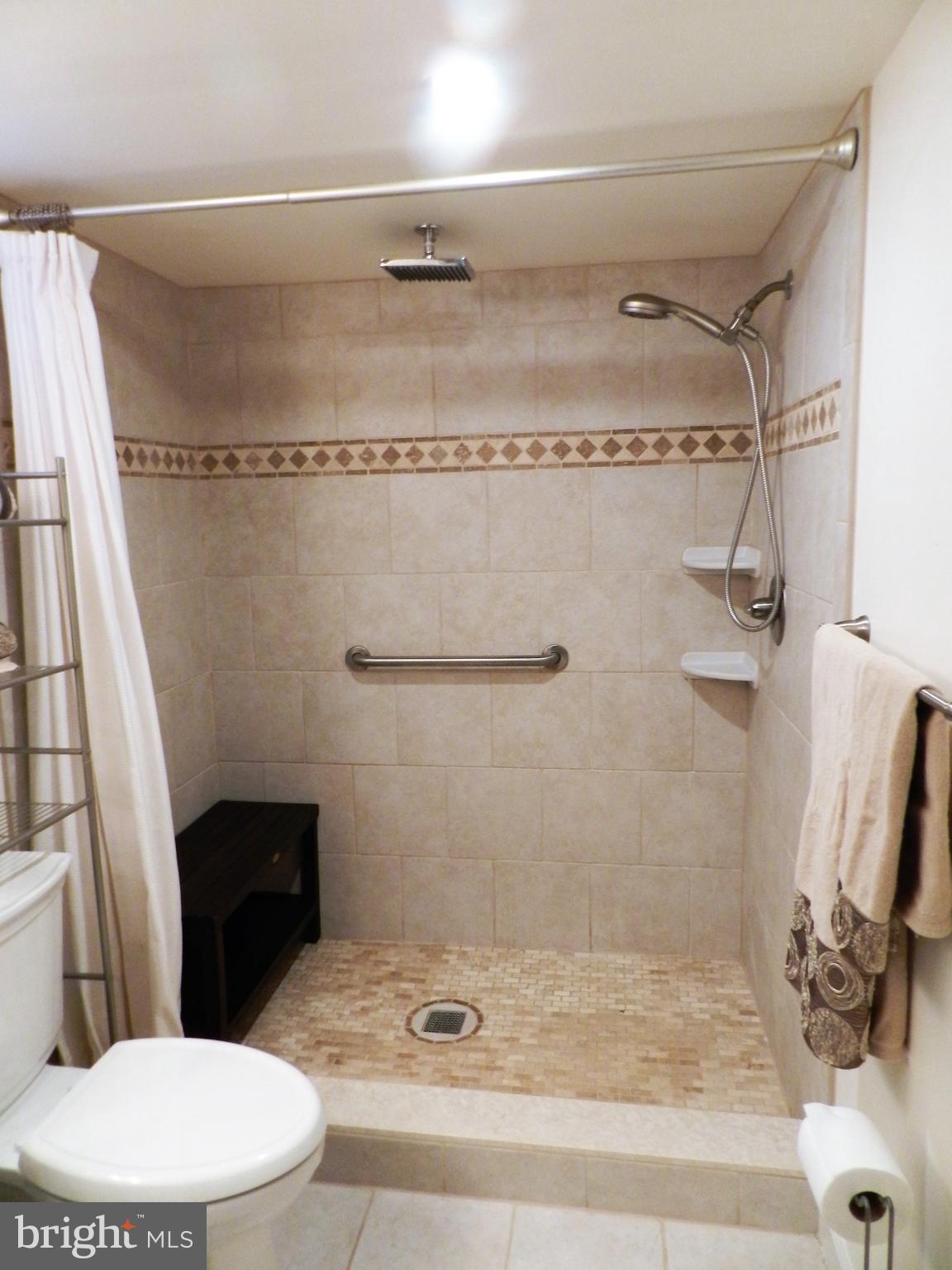 2436 Lakewood Road Baltimore, MD 21234 - Photo 25 of 31 New walk in ceramic tile shower with teak bench!