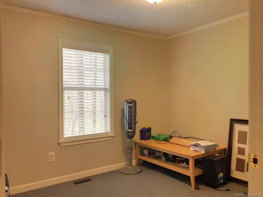 2915 Locust Grove Road Hendersonville, NC 28792 - Photo 19 of 30 a room with furniture and window