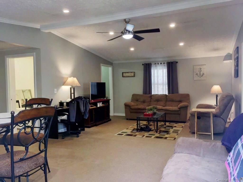 2915 Locust Grove Road Hendersonville, NC 28792 - Photo 5 of 30 a living room with furniture and a piano