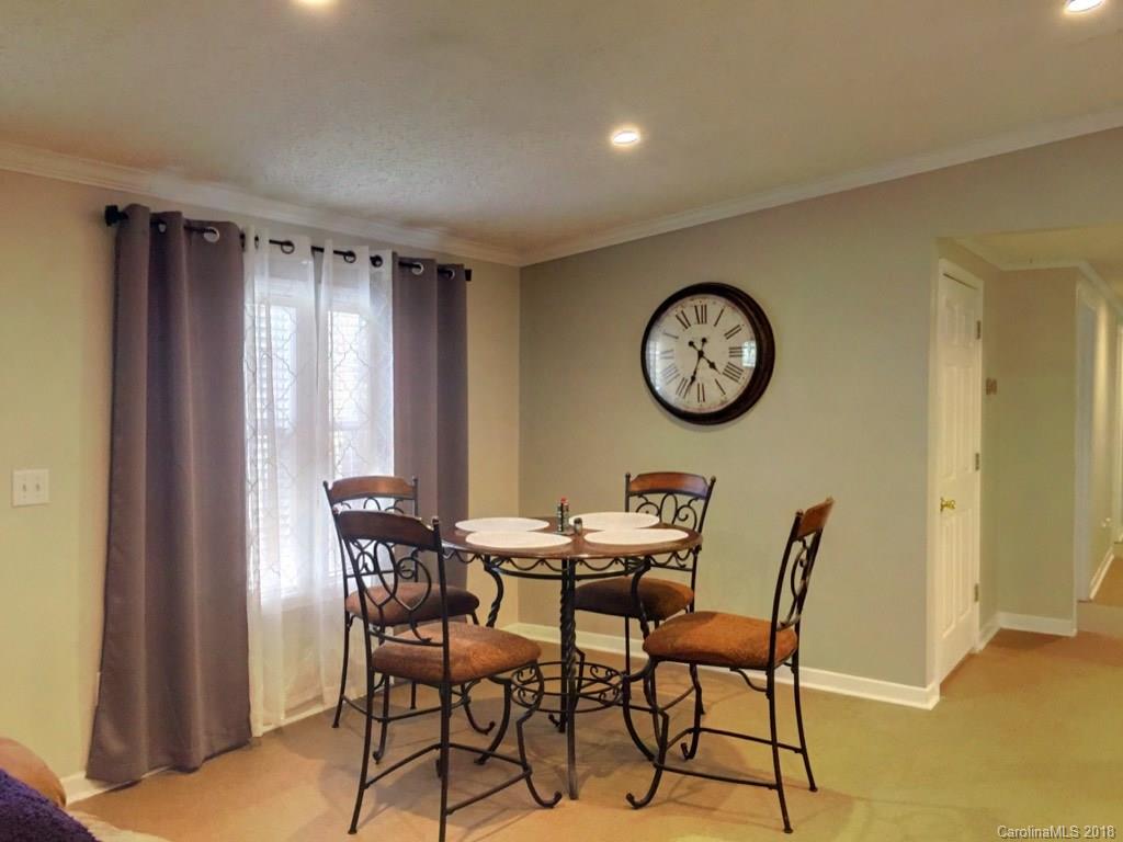 2915 Locust Grove Road Hendersonville, NC 28792 - Photo 10 of 30 a view of a dining area with furniture and a window