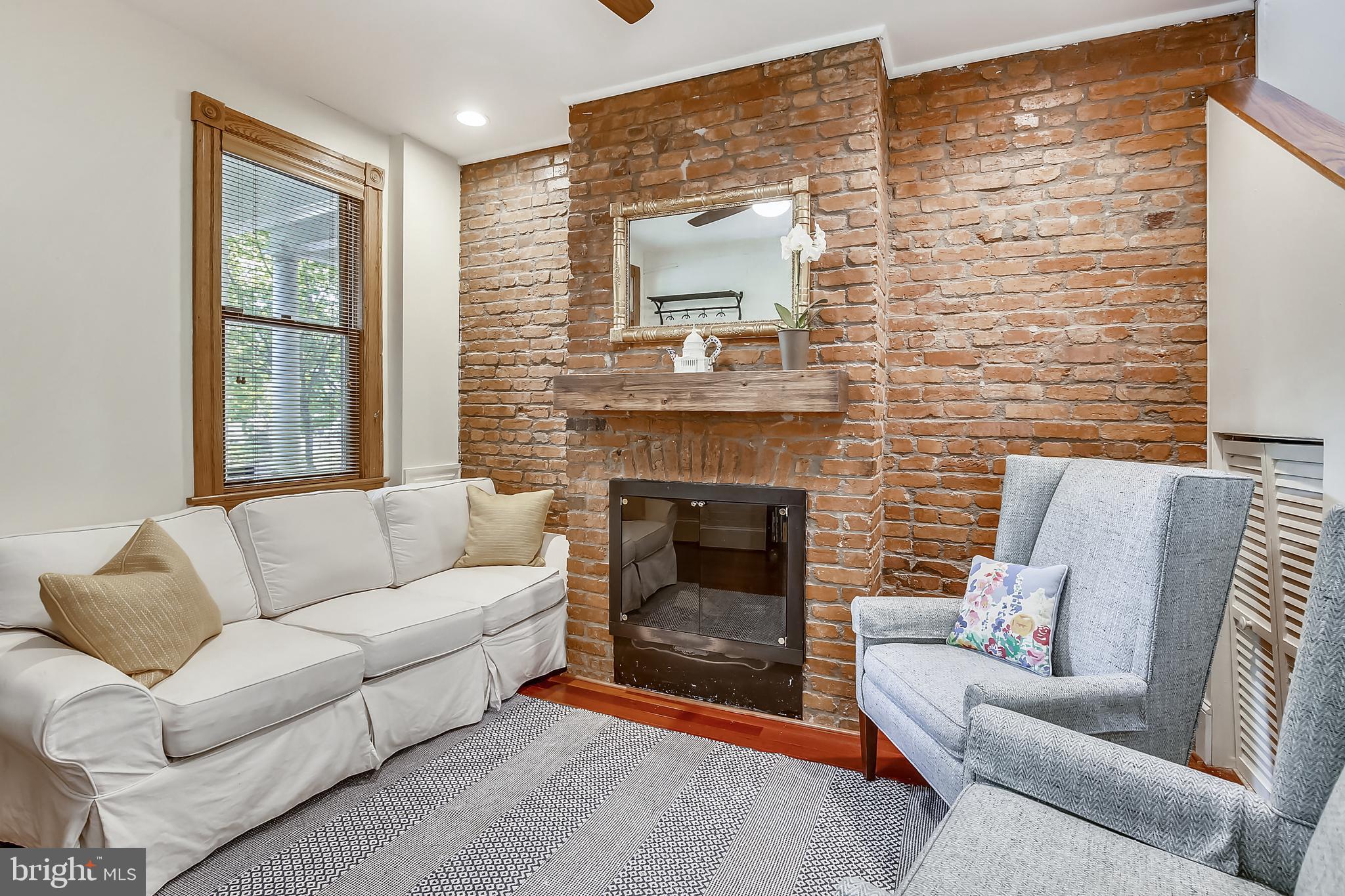 334 14th Street Northeast Washington, DC 20002 - Photo 3 of 30 A comfortable living room with a cozy fireplace.