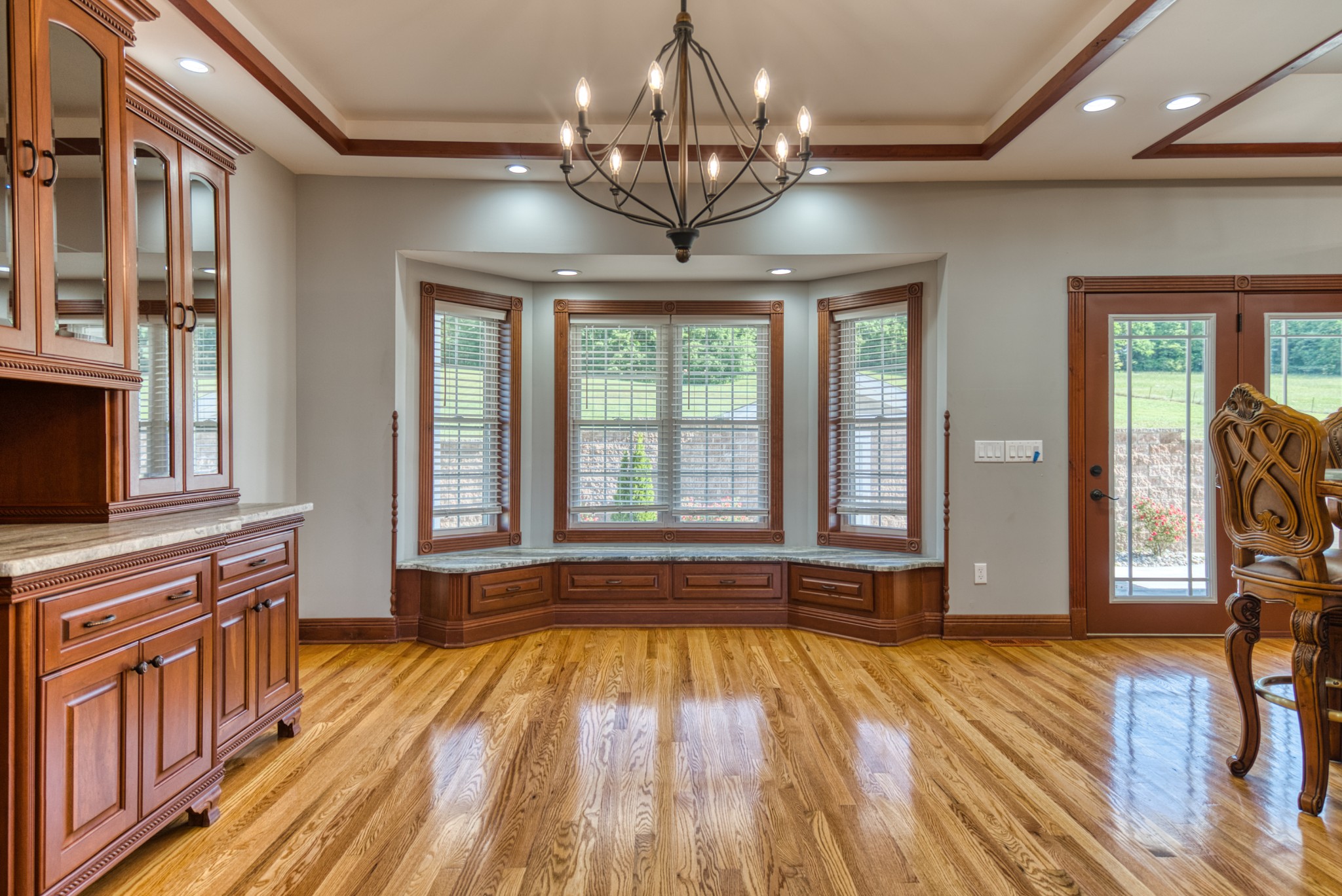 315 Blue And Gray Park Road Elkton, KY 42220 - Photo 26 of 66 a view of a room with wooden floor and chandelier