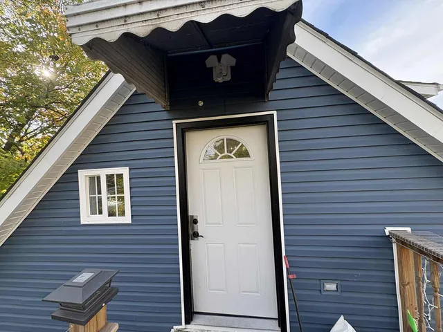 a view of a car park in front of house