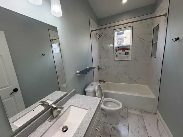 a bathroom with a sink a toilet and a bathtub