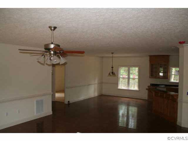1181 Cartersville Road Cartersville, VA 23027 - Photo 4 of 8 Other - Living Room with Ceiling Fan Crown Molding