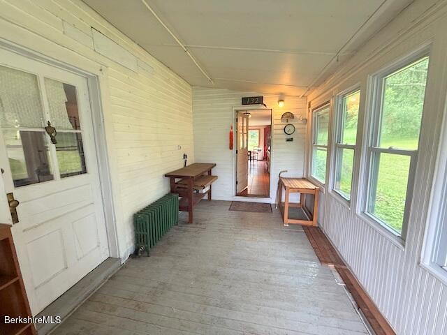 556 Mann Hill Road Pownal, VT 05261 - Photo 13 of 36 a view of a hallway with furniture and front door