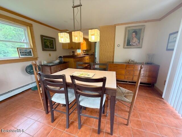 556 Mann Hill Road Pownal, VT 05261 - Photo 16 of 36 a dining room with furniture a window and a chandelier
