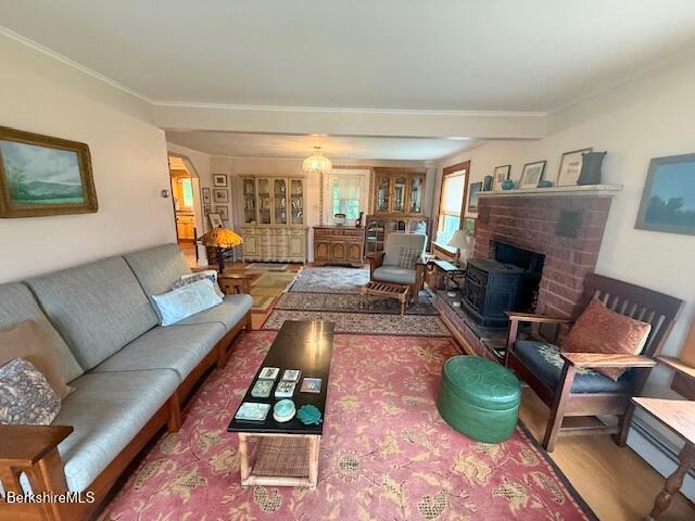 556 Mann Hill Road Pownal, VT 05261 - Photo 20 of 36 a living room with furniture fireplace and a large window