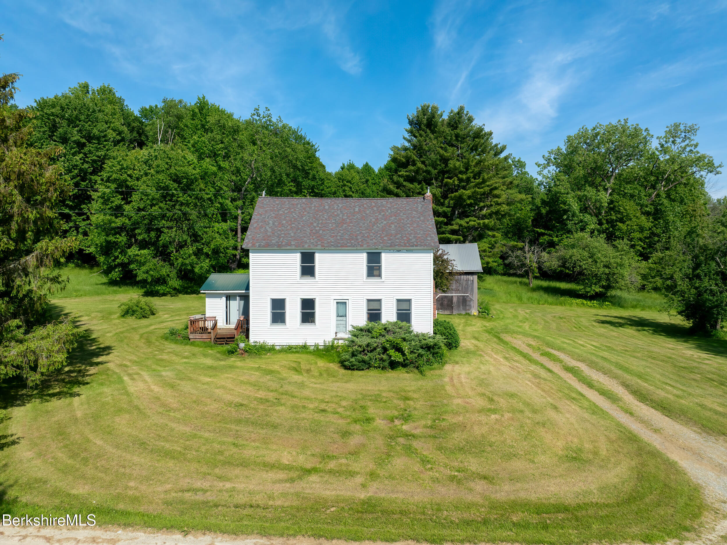 556 Mann Hill Road Pownal, VT 05261 - Photo 2 of 36 a house view with a garden space