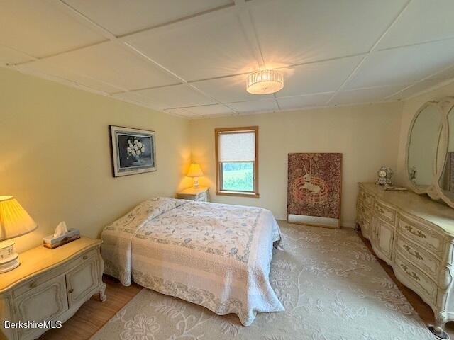 556 Mann Hill Road Pownal, VT 05261 - Photo 27 of 36 a spacious bedroom with a bed and a dresser in it