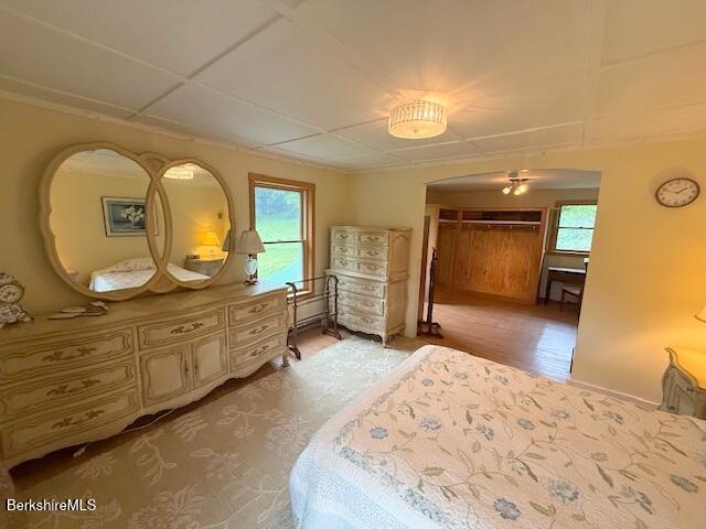 556 Mann Hill Road Pownal, VT 05261 - Photo 28 of 36 a bedroom with a bed and a dresser