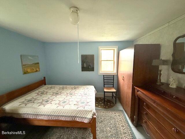 556 Mann Hill Road Pownal, VT 05261 - Photo 29 of 36 a bedroom with a bed and wooden floor