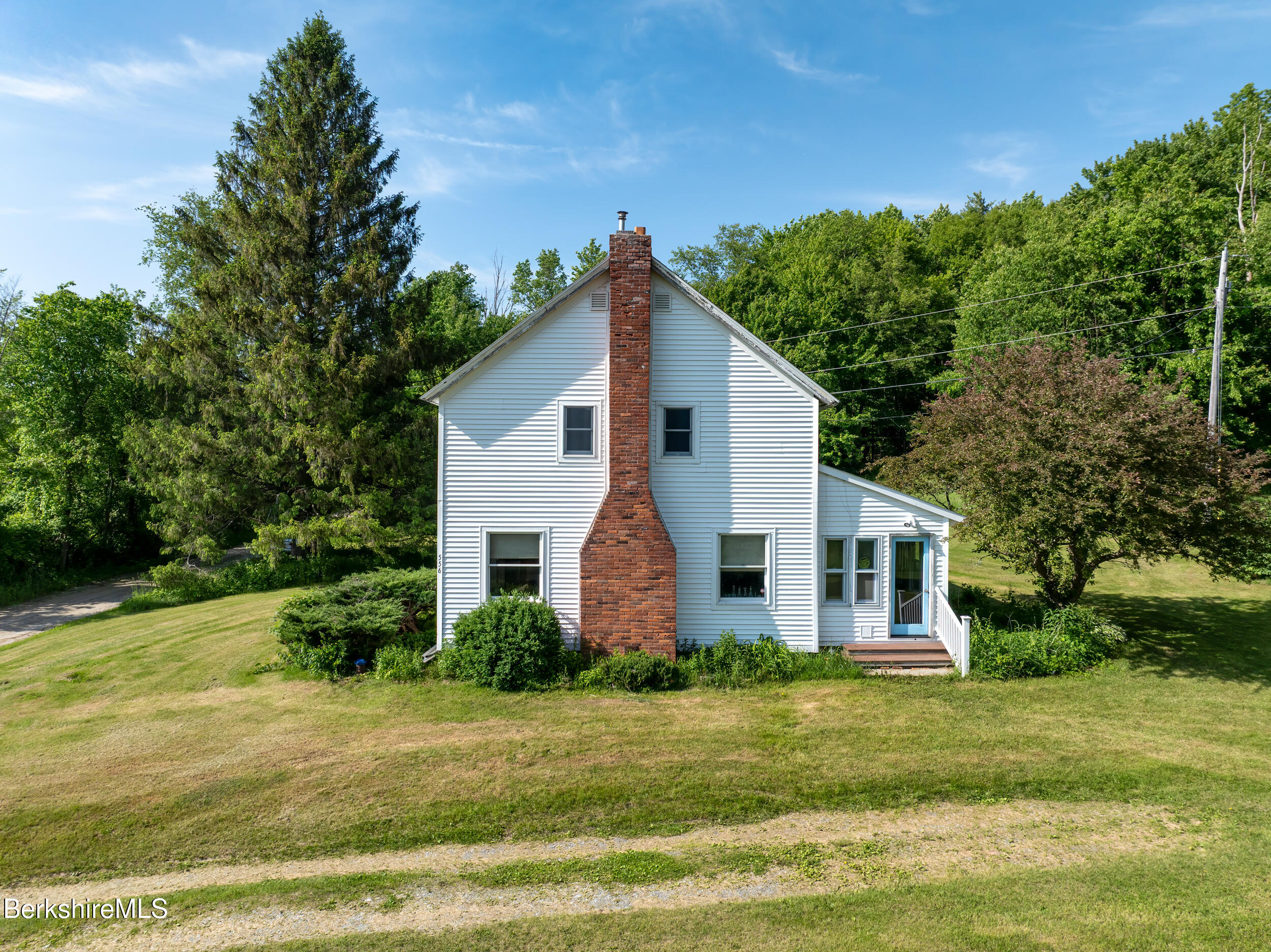 556 Mann Hill Road Pownal, VT 05261 - Photo 4 of 36 a front view of a house with a yard