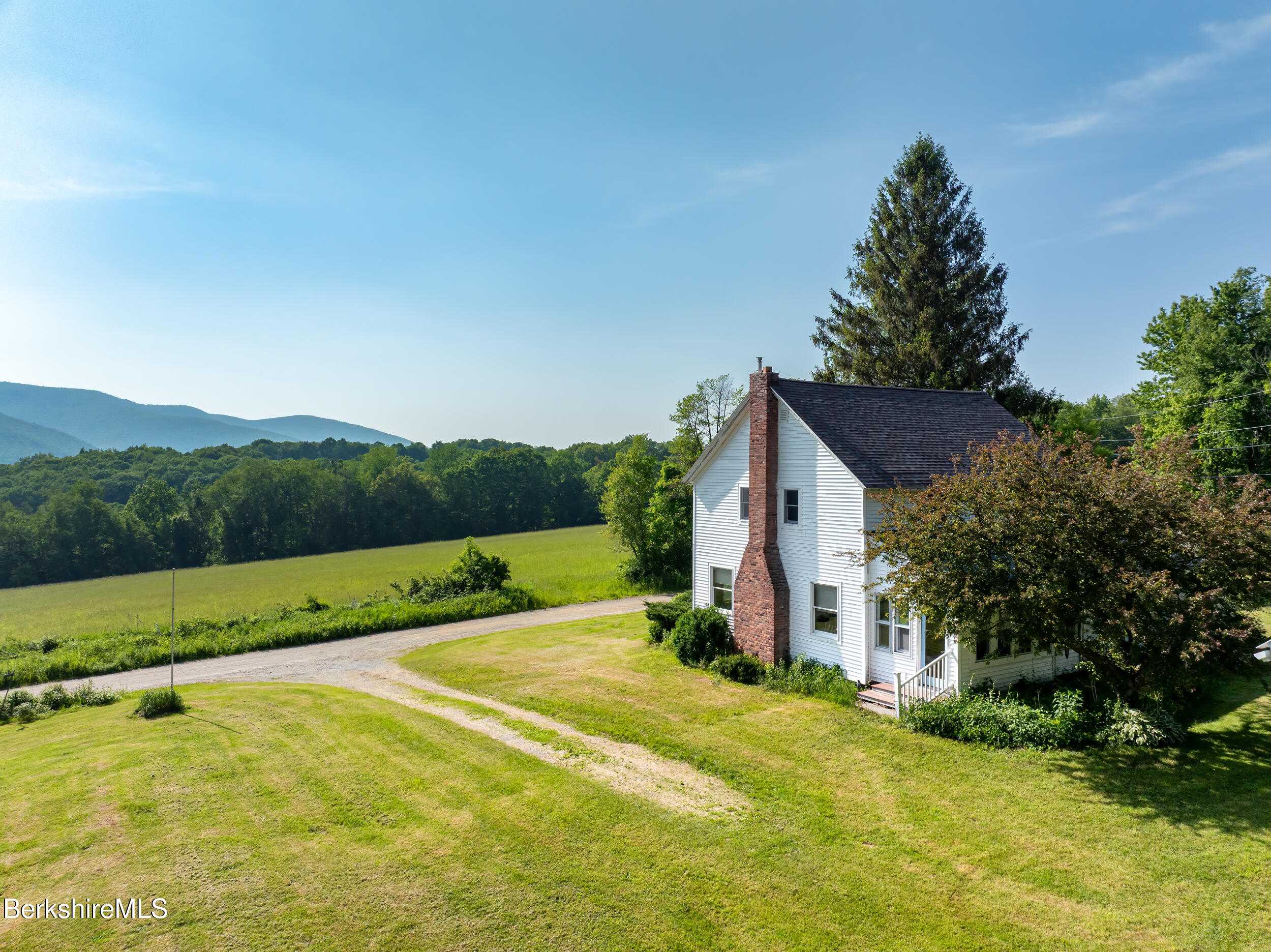 556 Mann Hill Road Pownal, VT 05261 - Photo 5 of 36 a view of a house with a yard