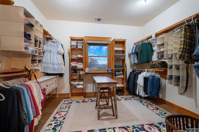 a living room with furniture a window and a chandelier