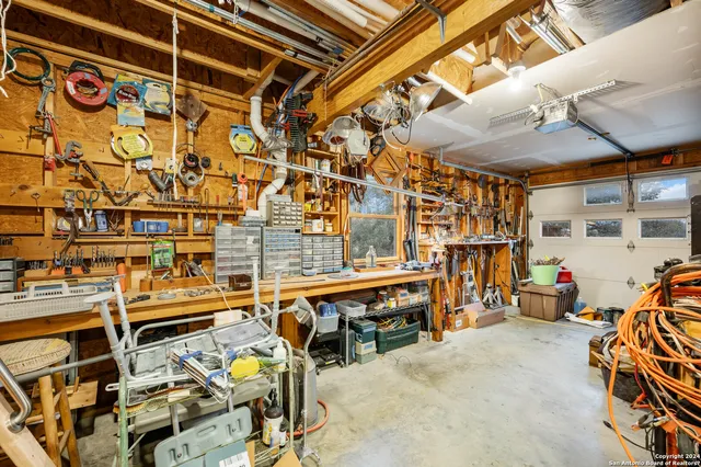 a kitchen with stainless steel appliances granite countertop refrigerator a sink a stove and island