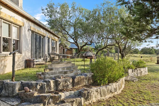 a view of swimming pool with outdoor seating and lake