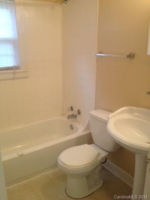 1314 Skyview Road Charlotte, NC 28208 - Photo 7 of 12 a very nice looking room with a chair