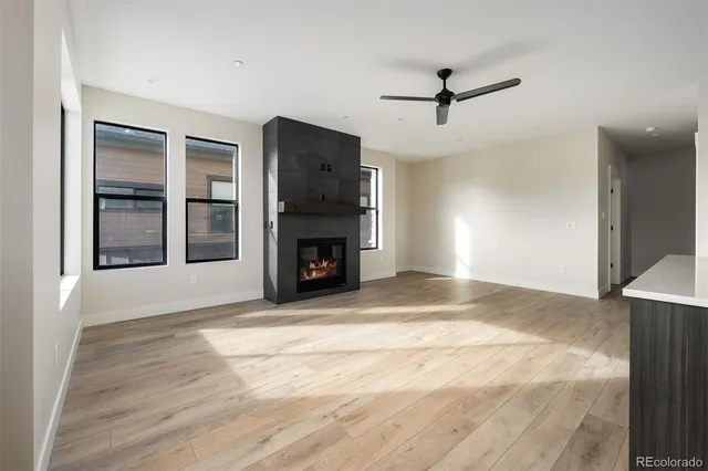 a view of a kitchen with a sink and a refrigerator