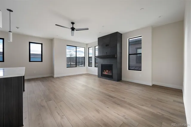 a view of kitchen with sink and wooden cabinet