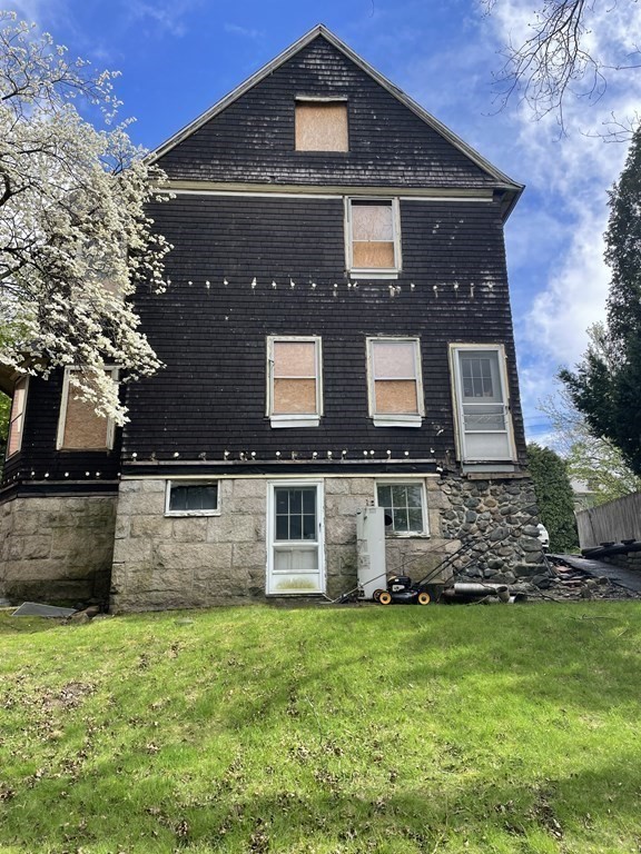 29 Hunter Street Newton, MA 02465 - Photo 2 of 10 a front view of a house with a yard
