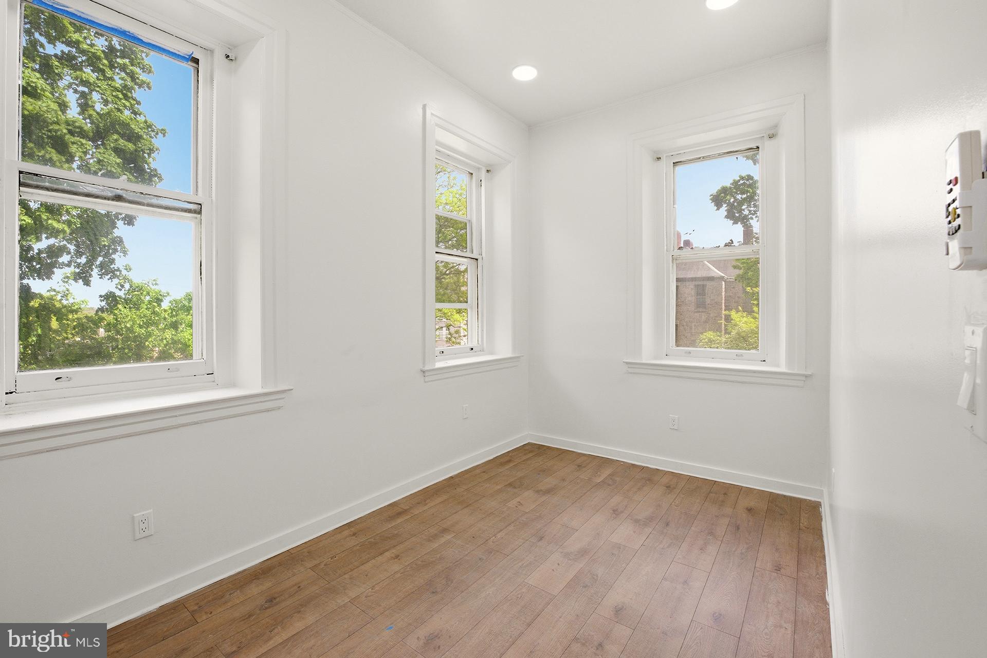 6012 Ridge Avenue, Unit 5 Philadelphia, PA 19128 - Photo 11 of 19 an empty room with windows