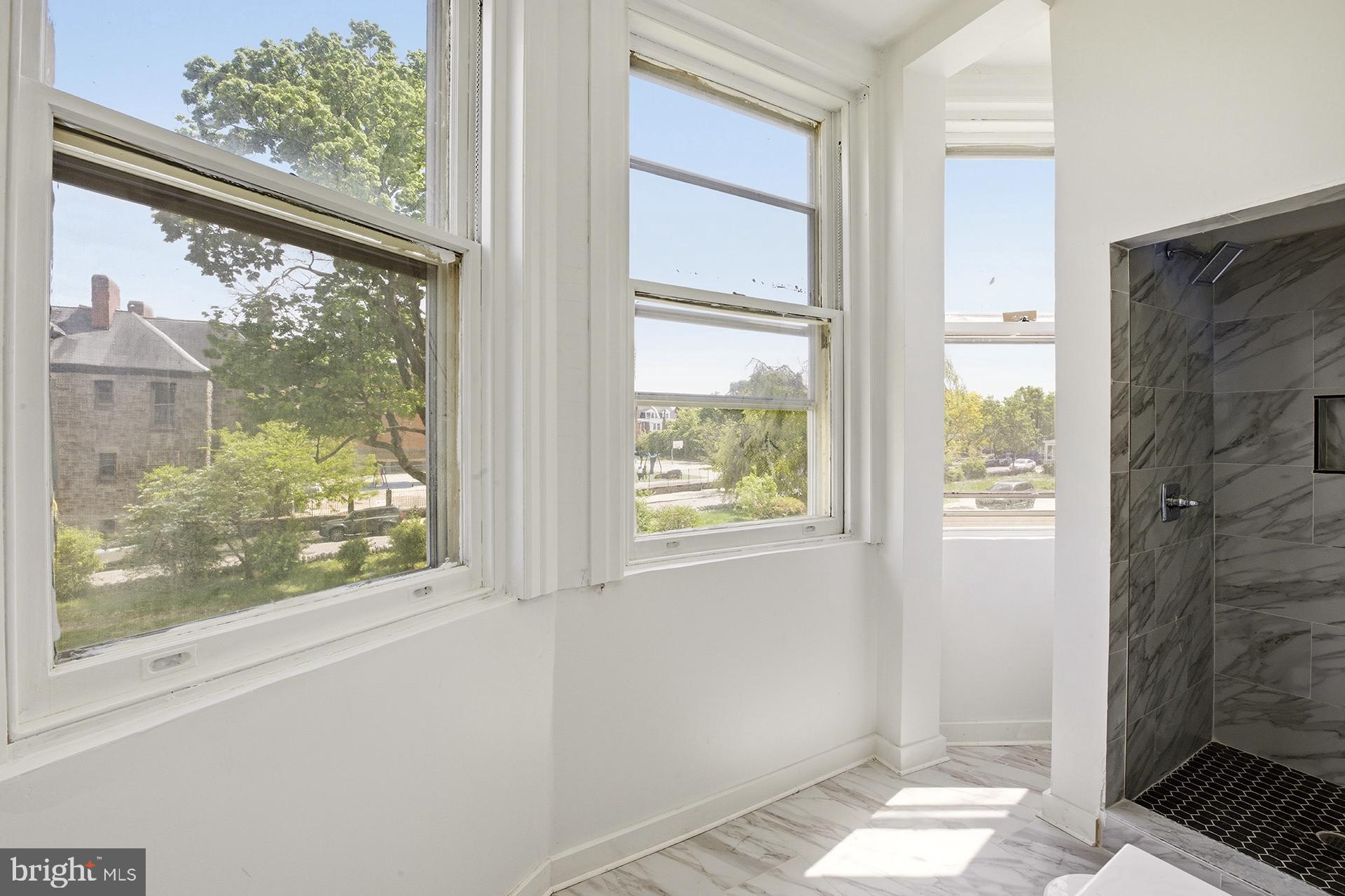 6012 Ridge Avenue, Unit 5 Philadelphia, PA 19128 - Photo 13 of 19 a view of a glass door with a window
