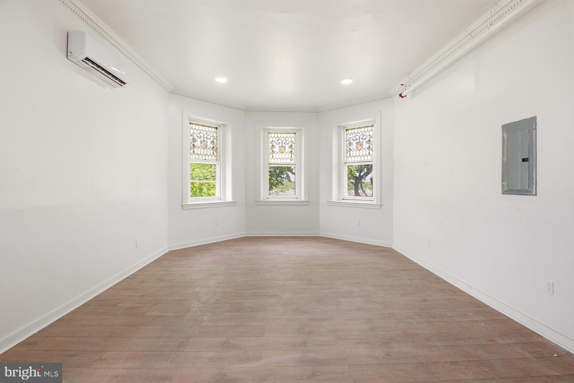 6012 Ridge Avenue, Unit 5 Philadelphia, PA 19128 - Photo 5 of 19 an empty room with windows and closet