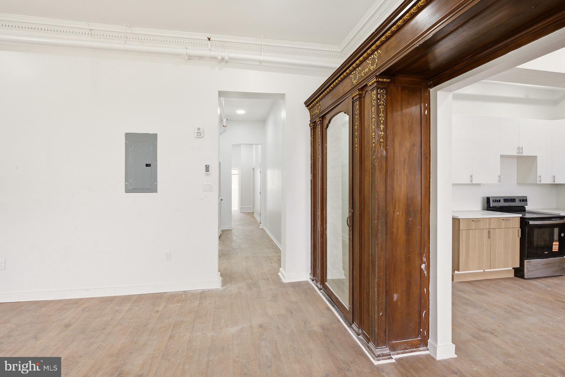 6012 Ridge Avenue, Unit 5 Philadelphia, PA 19128 - Photo 7 of 19 a view of a hallway with a dining table and chairs