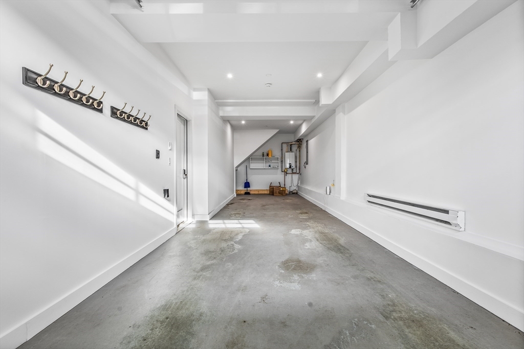 360 Athens Street, Unit 360 Boston, MA 02127 - Photo 22 of 27 a view of a hallway with staircase