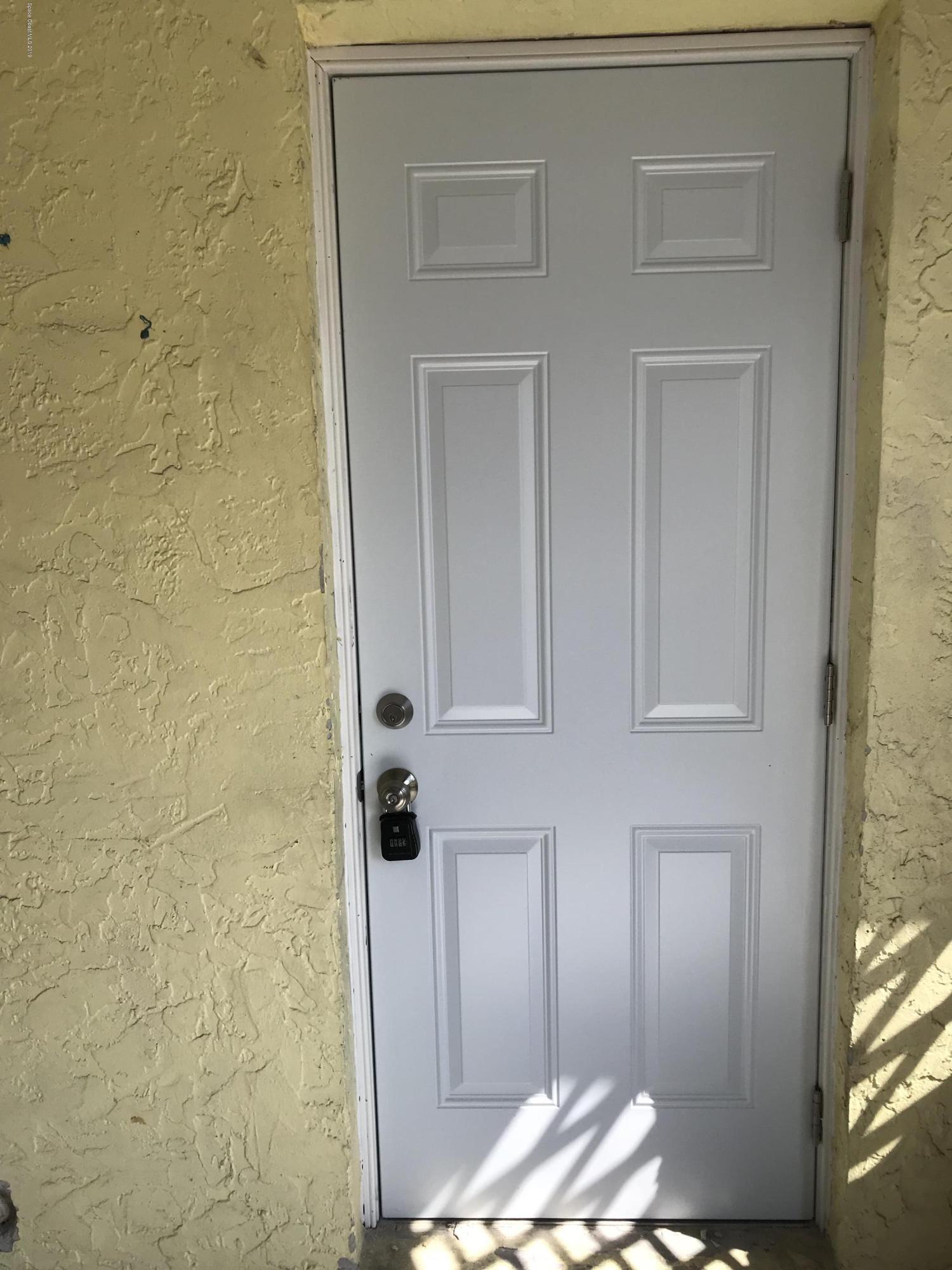 2820 Lancaster Road Melbourne, FL 32935 - Photo 2 of 30 Side door entrance