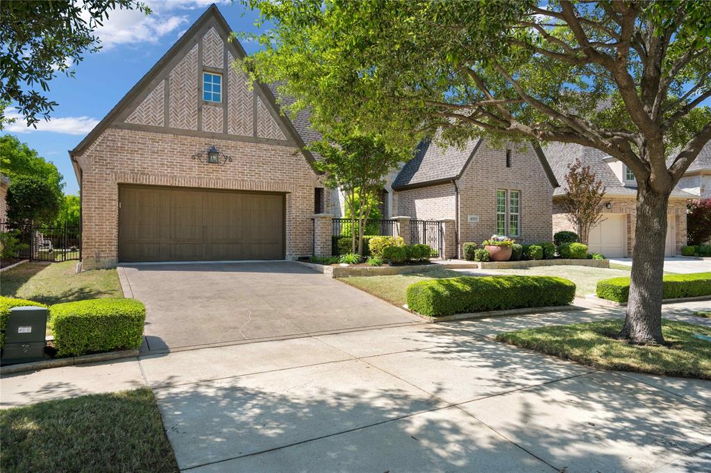 4111 Broadmoor Way Frisco, TX 75033 - Photo 1 of 38 a front view of a house with a garden and trees