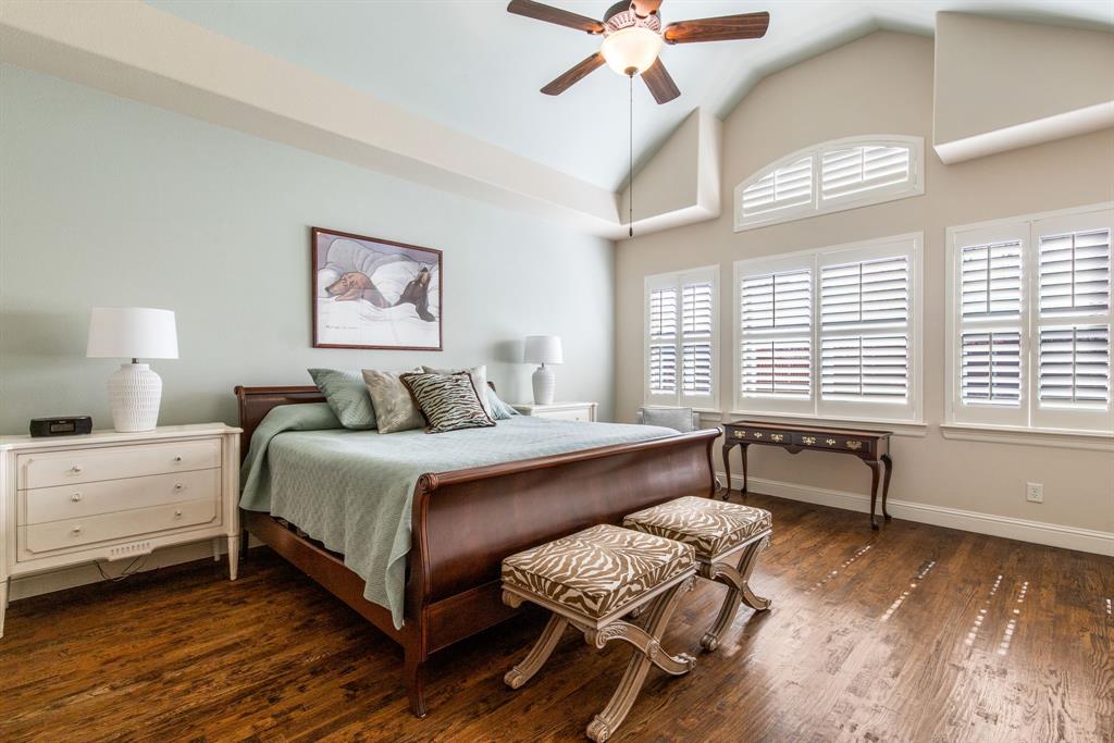 4111 Broadmoor Way Frisco, TX 75033 - Photo 16 of 38 a spacious bedroom with a bed and a chandelier