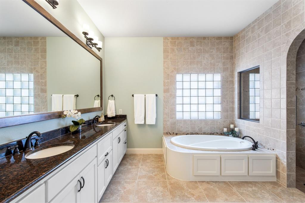 4111 Broadmoor Way Frisco, TX 75033 - Photo 19 of 38 a spacious bathroom with sinks mirror and a bathtub