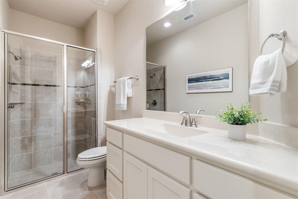 4111 Broadmoor Way Frisco, TX 75033 - Photo 23 of 38 a bathroom with a sink a toilet and shower