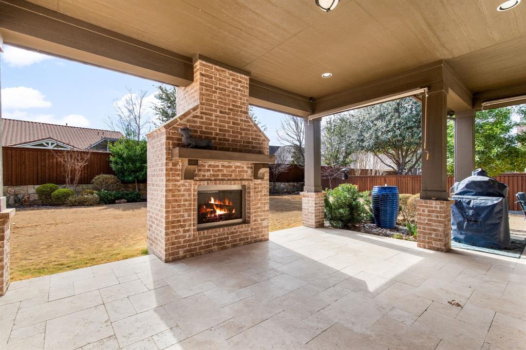 4111 Broadmoor Way Frisco, TX 75033 - Photo 31 of 38 a living room with furniture and a fireplace