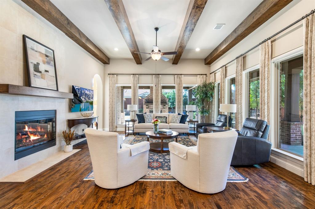 4111 Broadmoor Way Frisco, TX 75033 - Photo 7 of 38 a living room with patio furniture and a fireplace