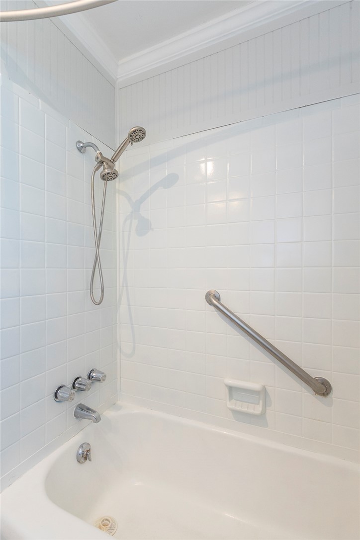 1218 Bolt Drive Anderson, SC 29621 - Photo 32 of 46 A well-maintained tub and shower combination with clean tilework and an accessible grab bar.