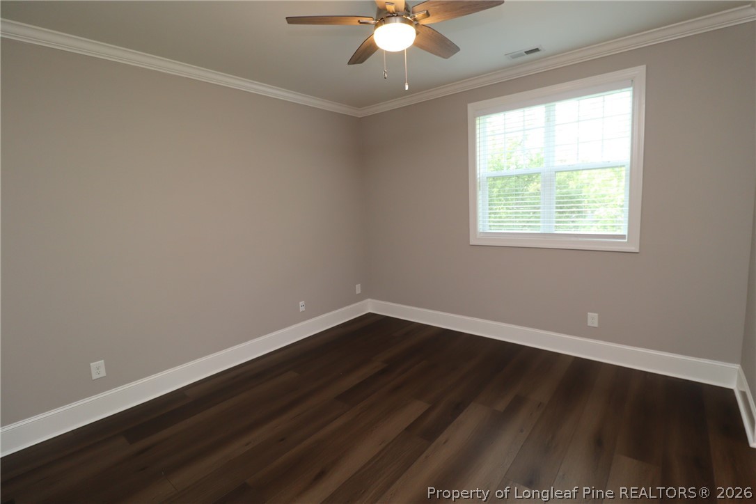 2824 Plumfield Place Raleigh, NC 27607 - Photo 21 of 33 an empty room with wooden floor and windows